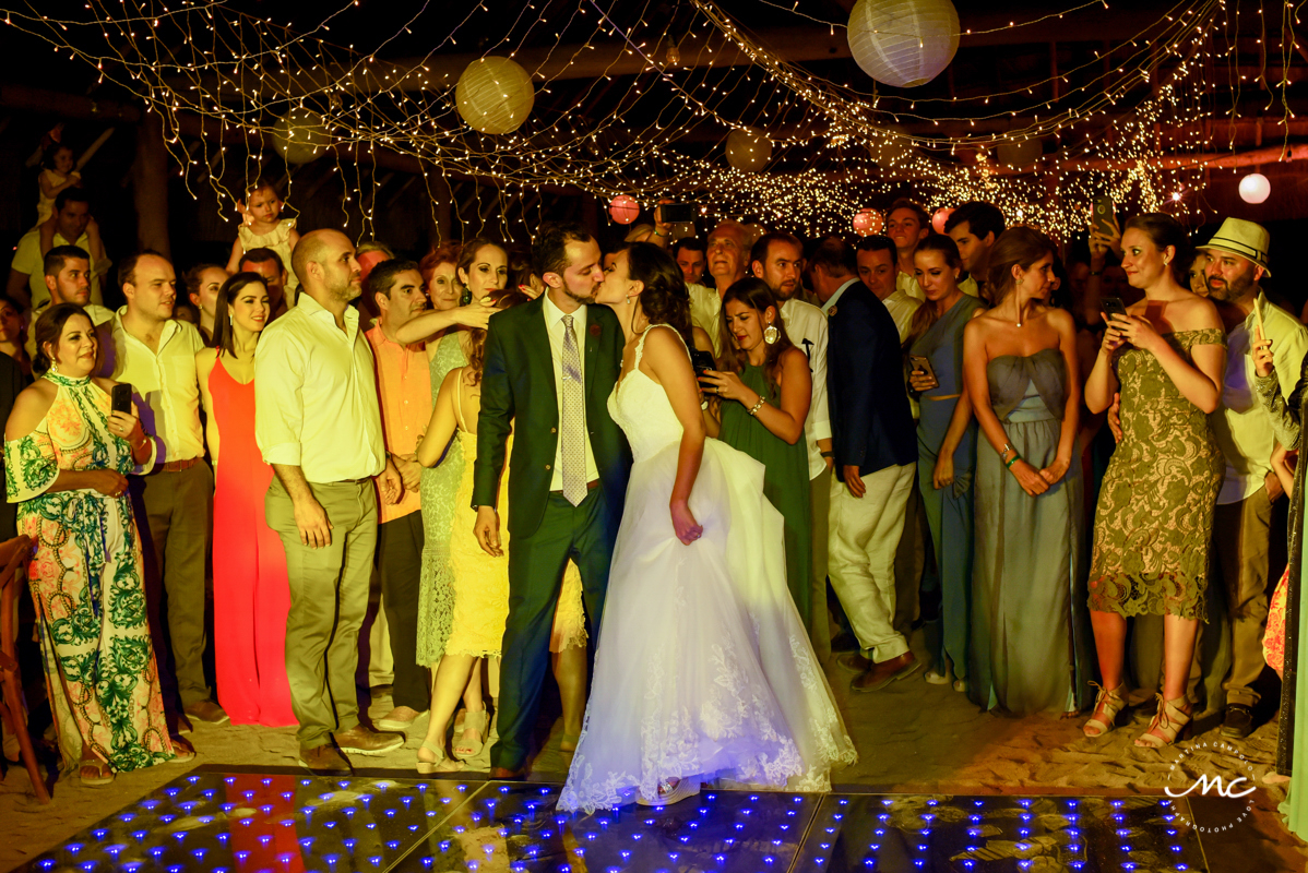 Bride and groom kiss at Blue Venado Wedding Reception in Mexico by Martina Campolo Photography